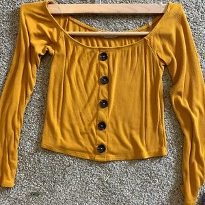 Yellow long sleeved top with buttons